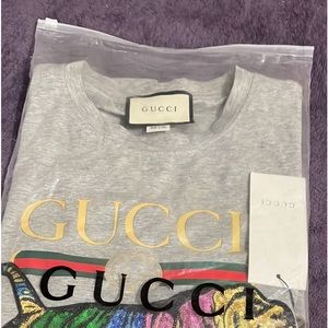 Authentic Gucci tee shirt for sale with tags on it.